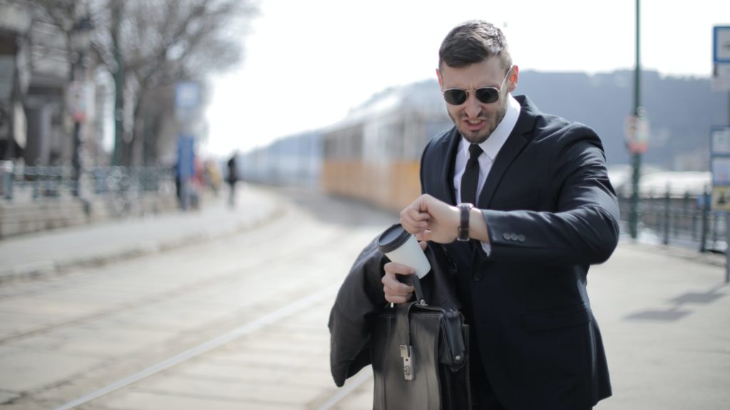 a man looking at his watch