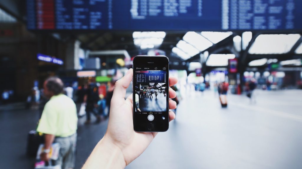 a hand holding a phone