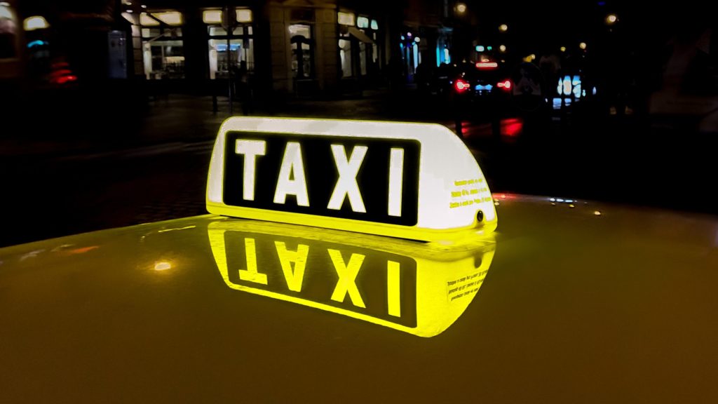 a taxi sign on a car