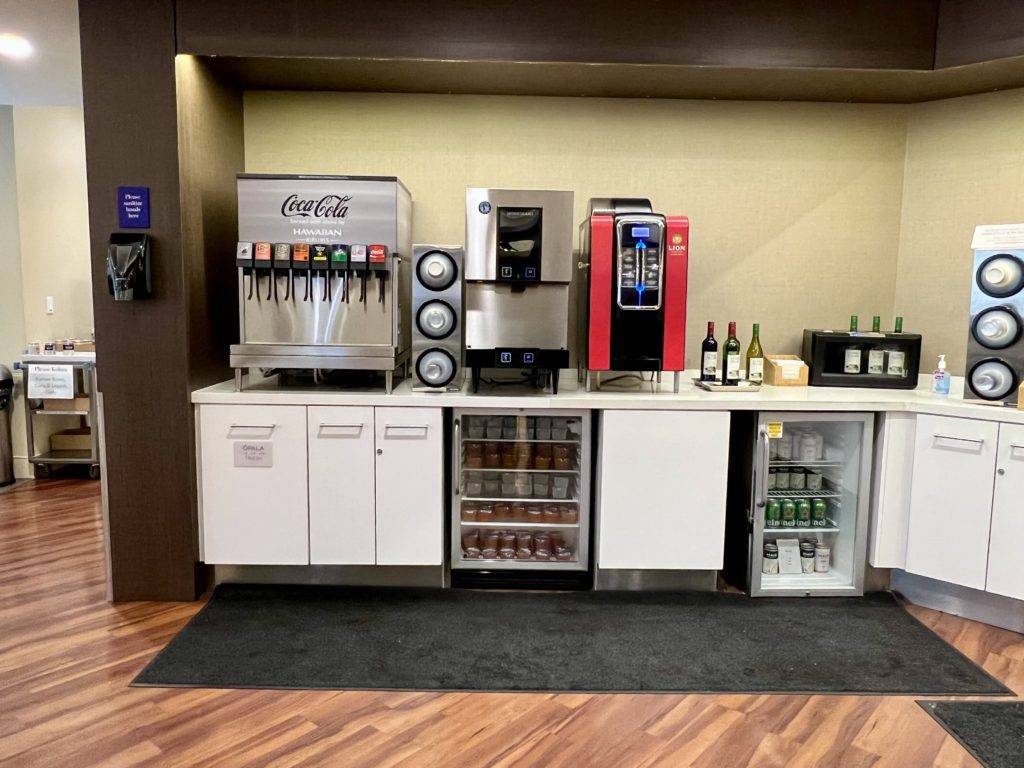 a group of soda machines on a counter