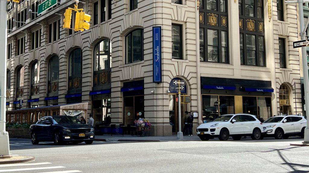 a building with a sign on the corner