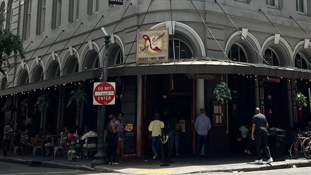 a group of people outside of a restaurant