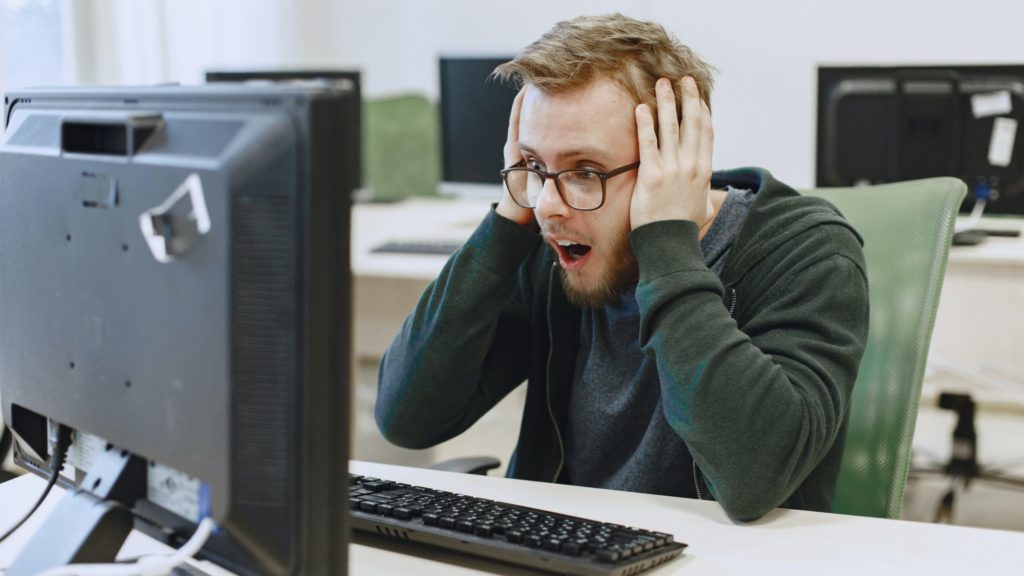 a man looking at a computer screen