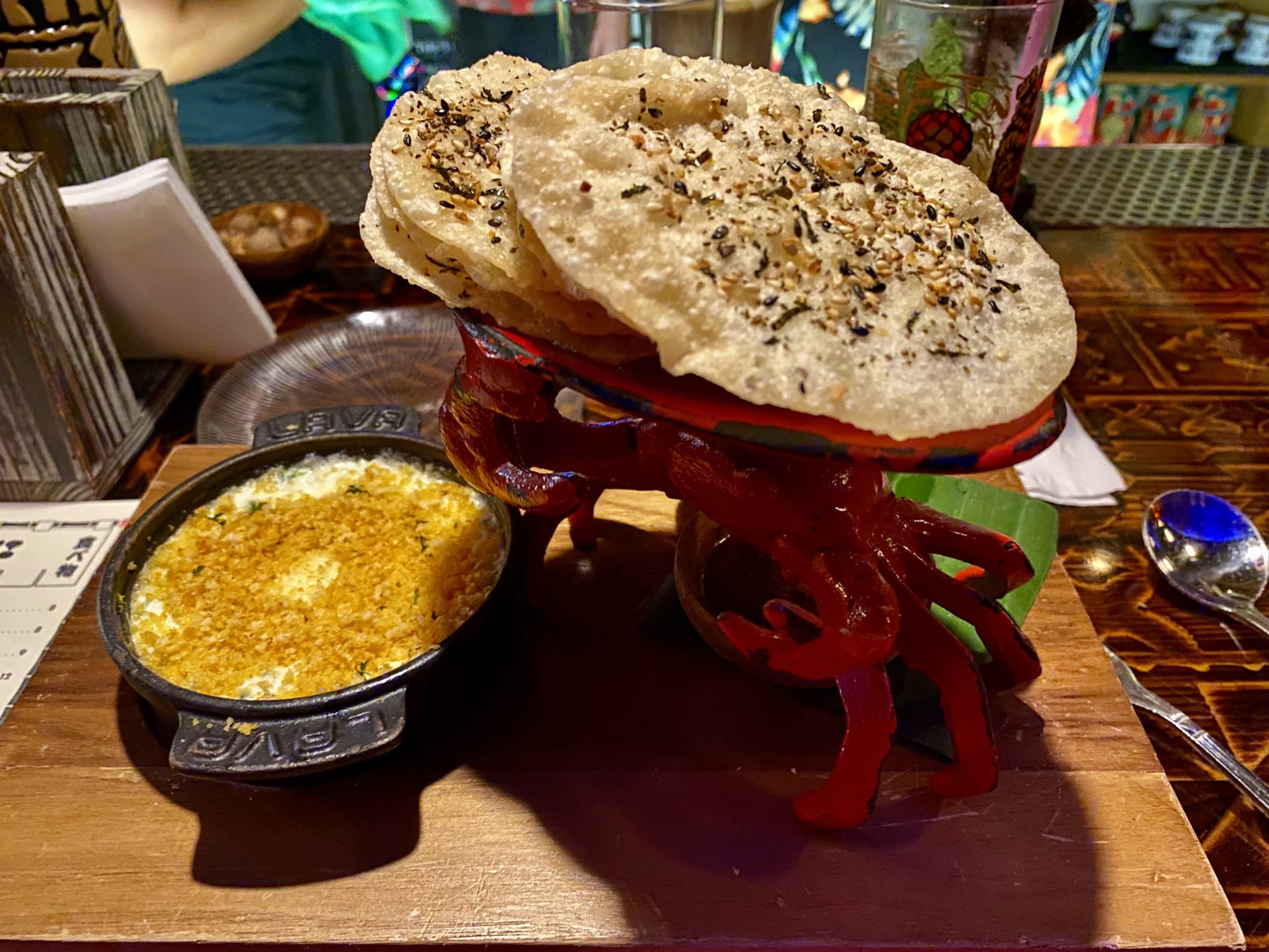 a crab shaped food on a wooden surface