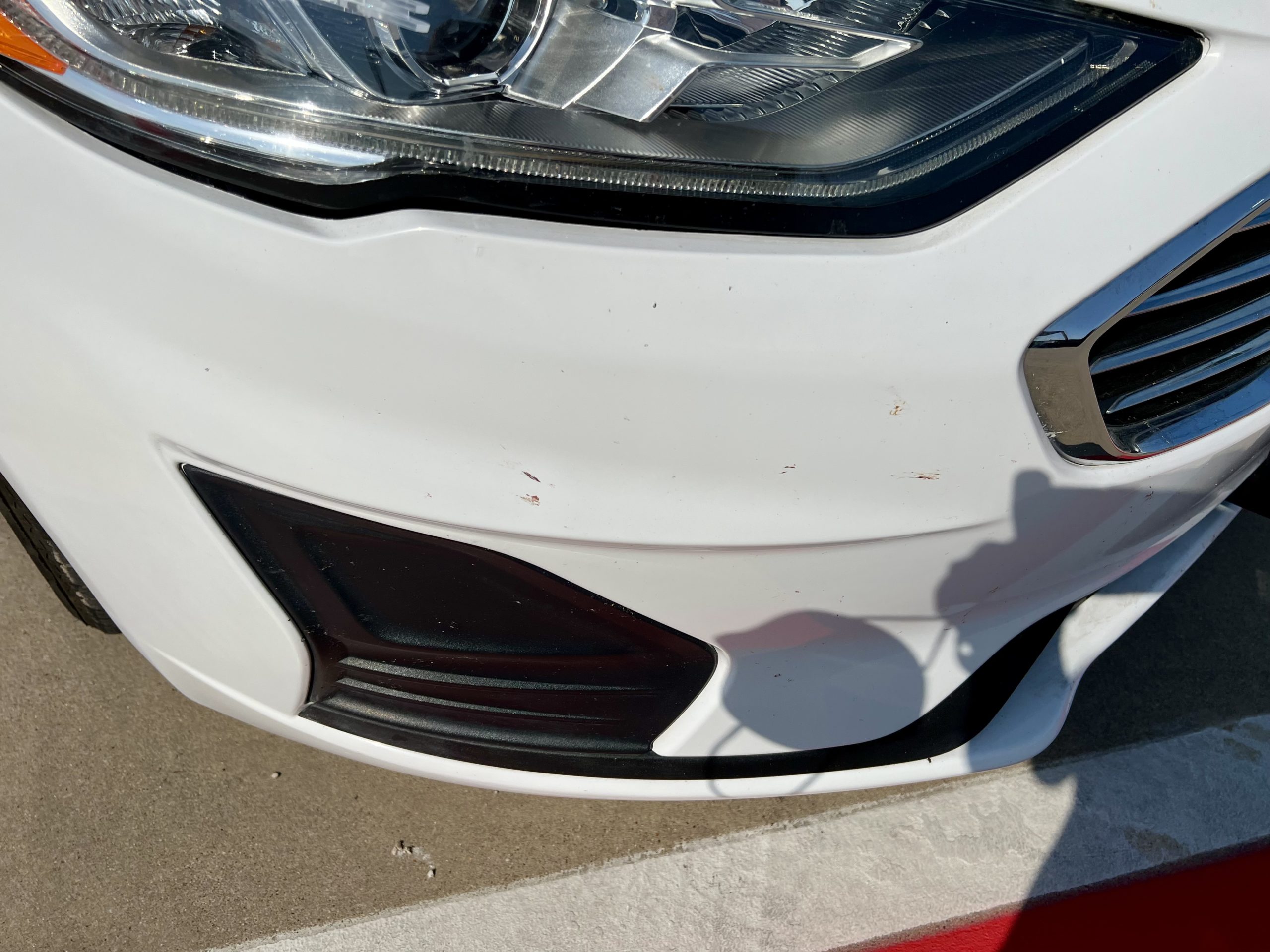 the front bumper of a white car