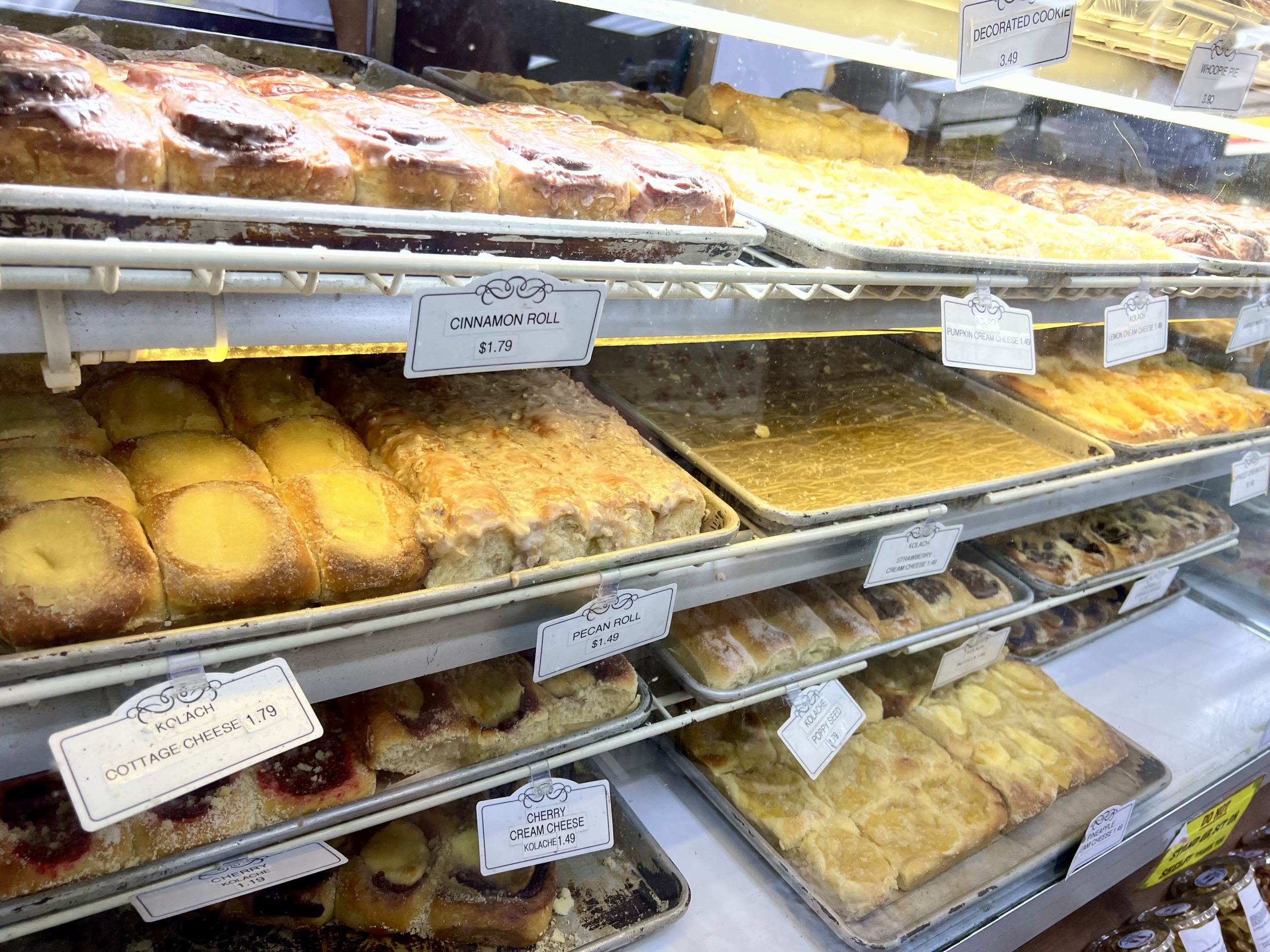 a display case with pastries and pastries