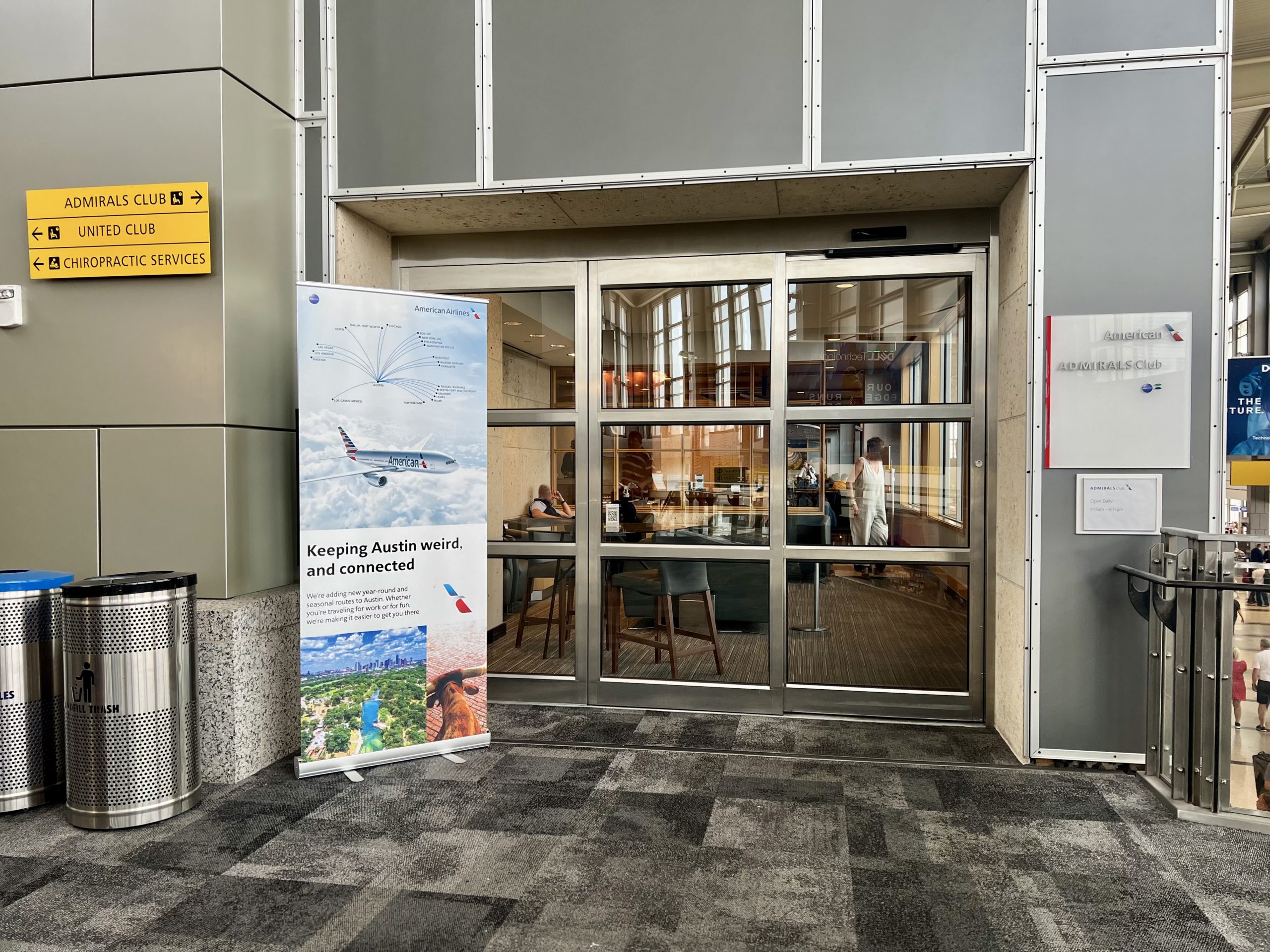 a sign in front of a glass door