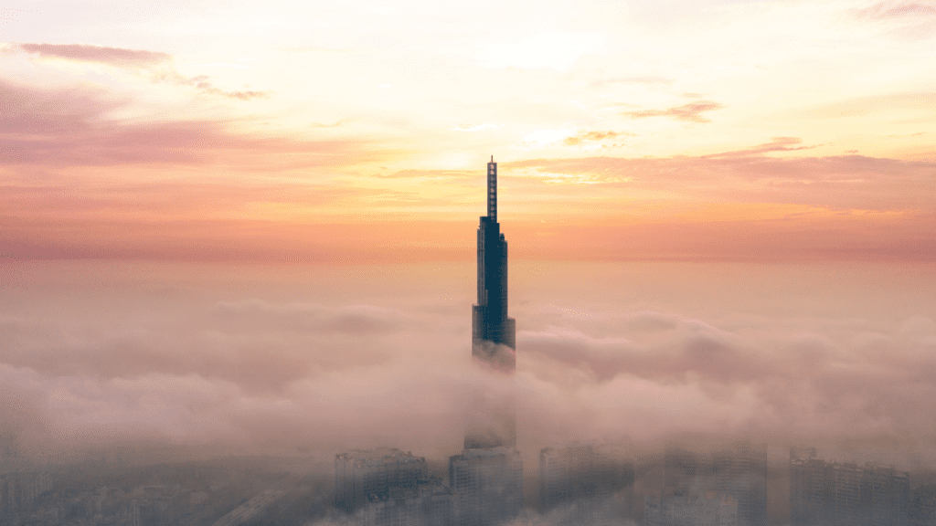 a tall building in the clouds