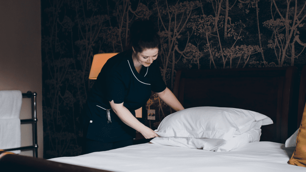 a woman making a bed