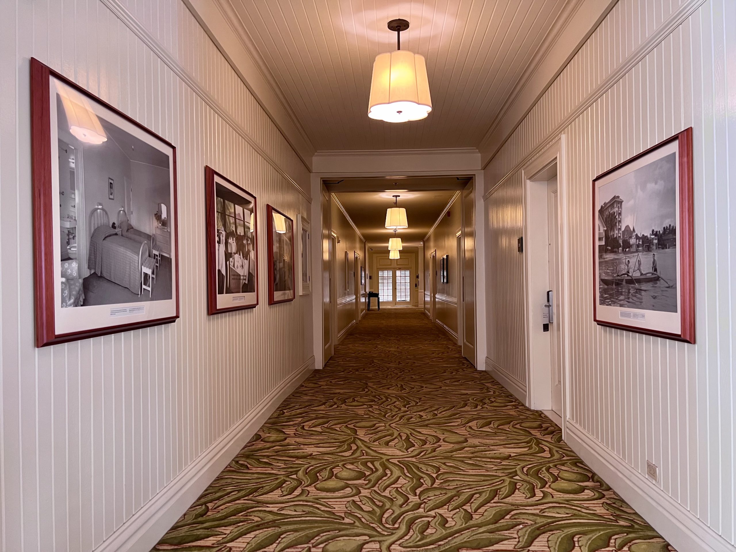 a hallway with pictures on the wall