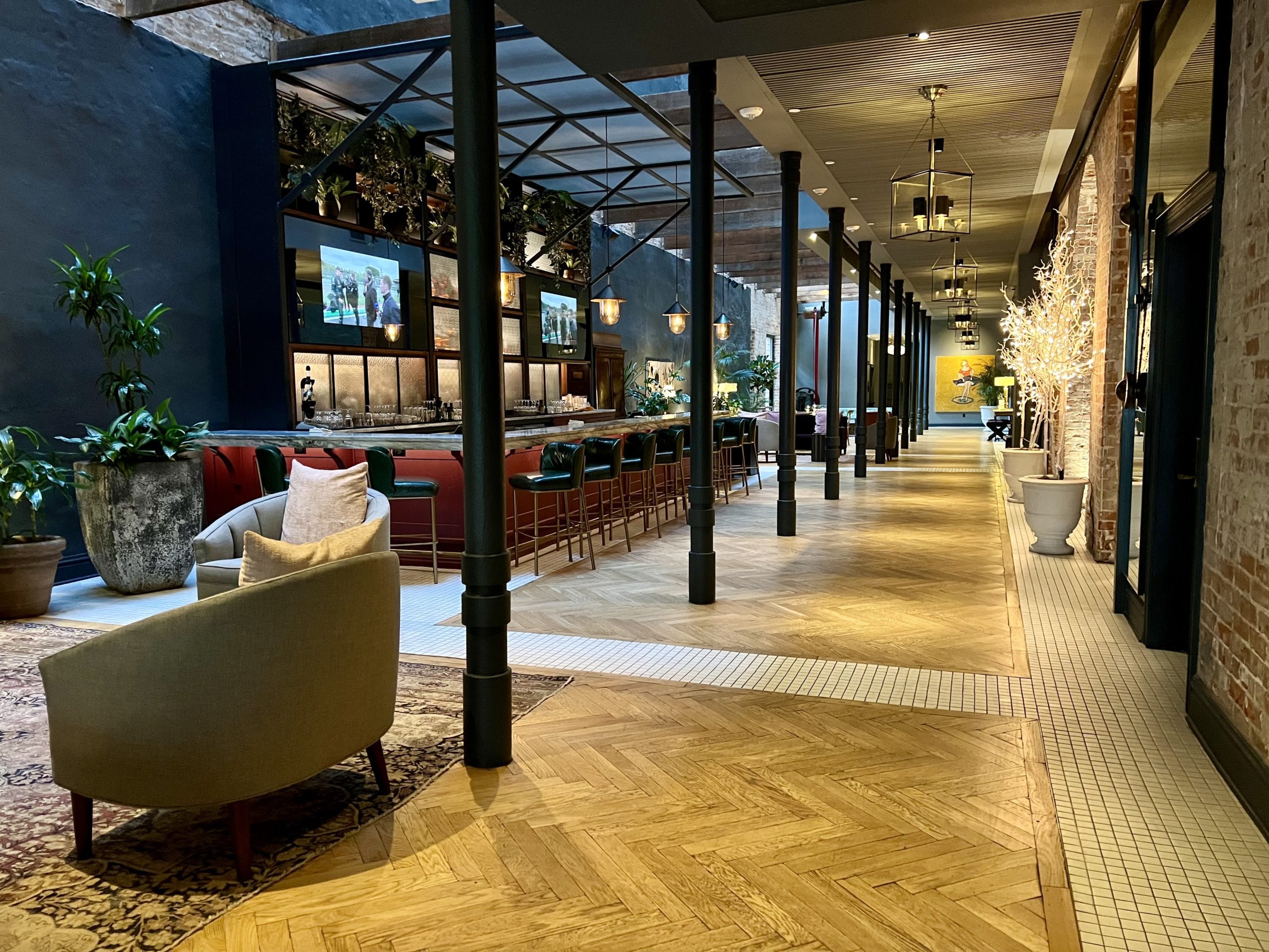 a long hallway with chairs and tables