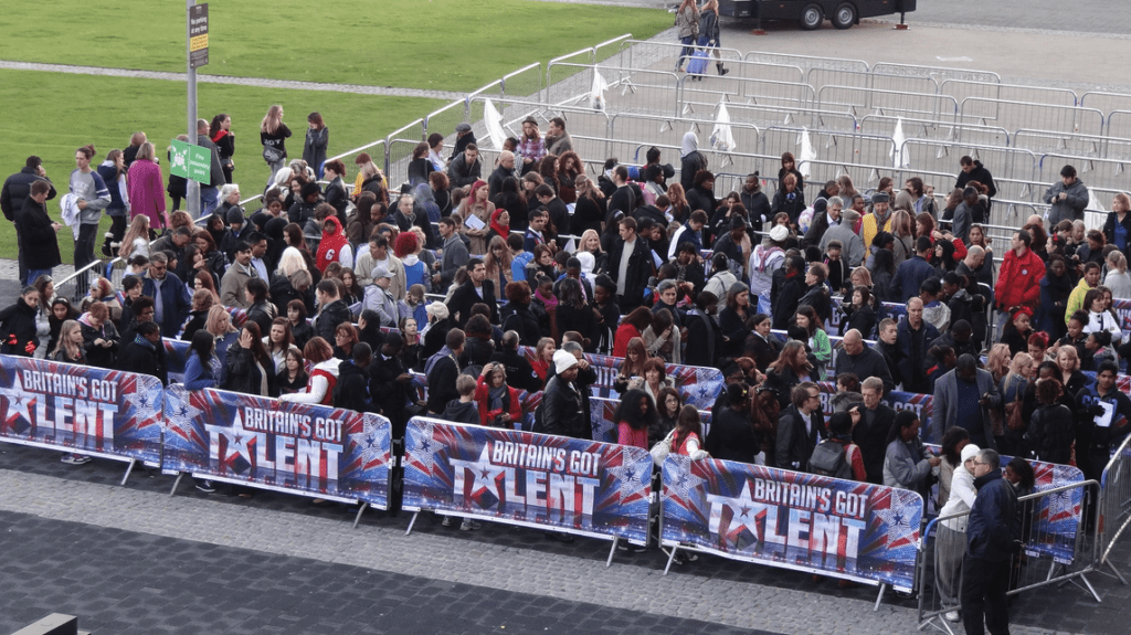 a large group of people standing in a crowd