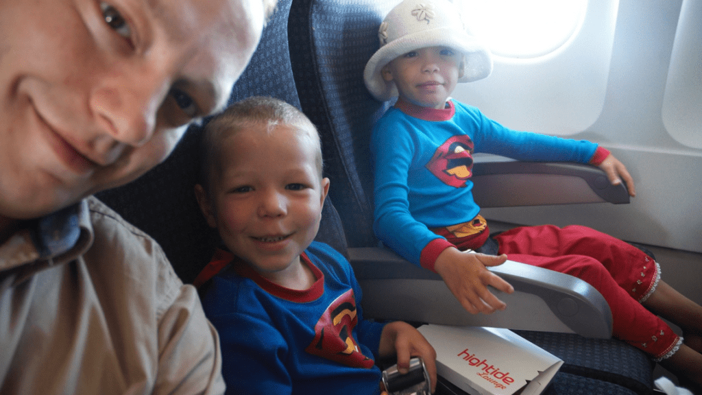 a group of kids sitting in a plane