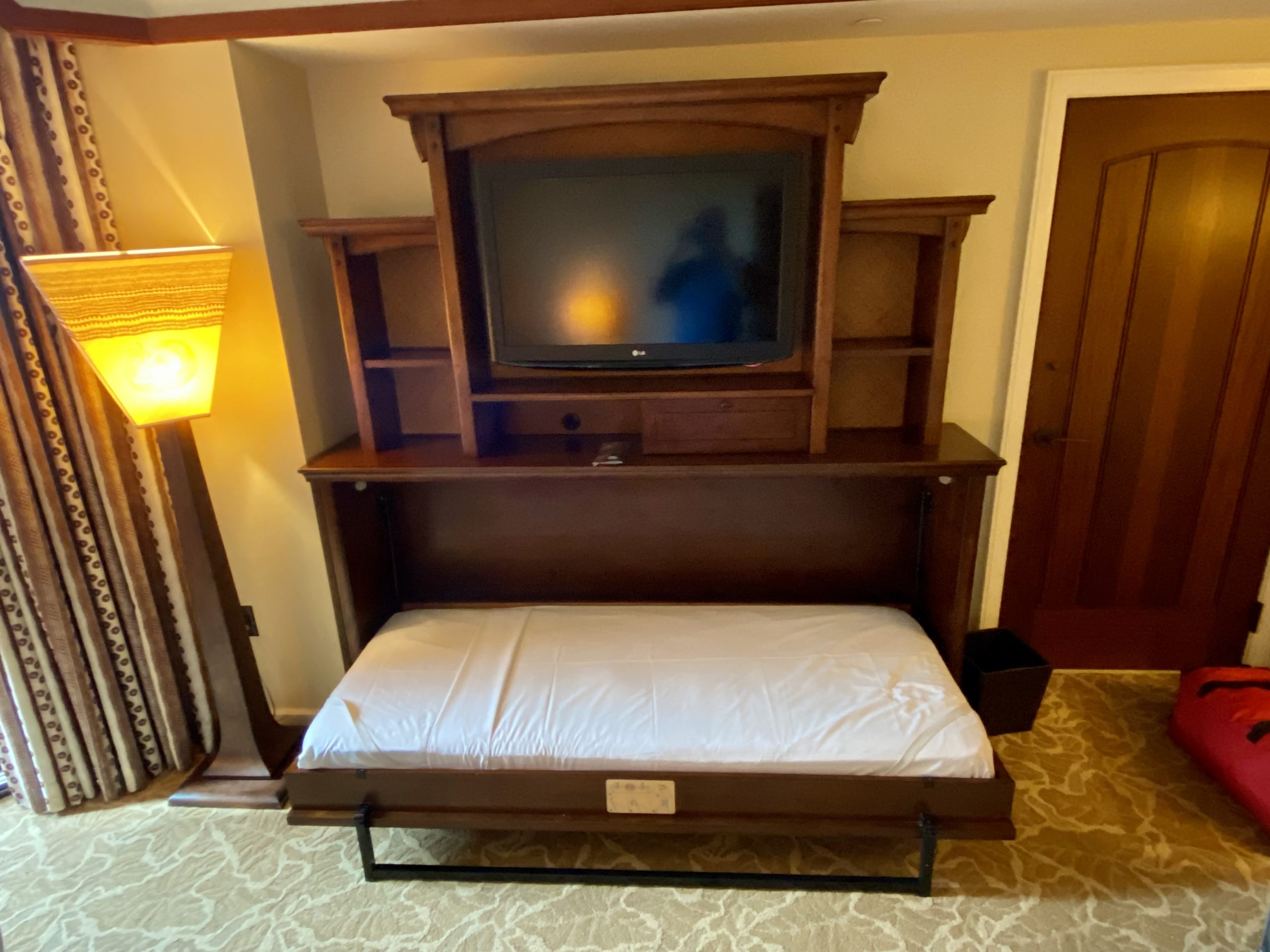 a bed with a tv on it
