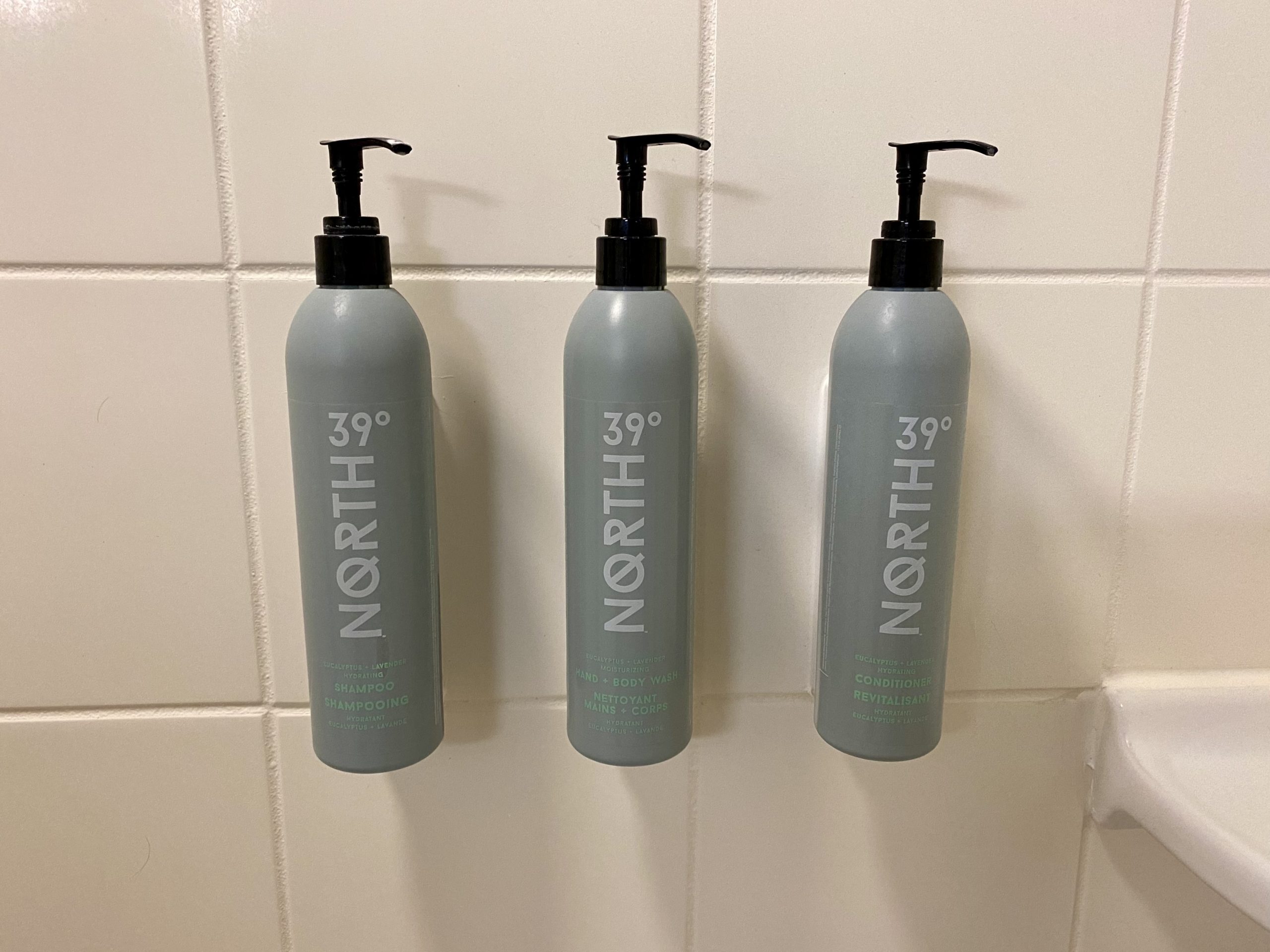 a group of bottles on a tile wall