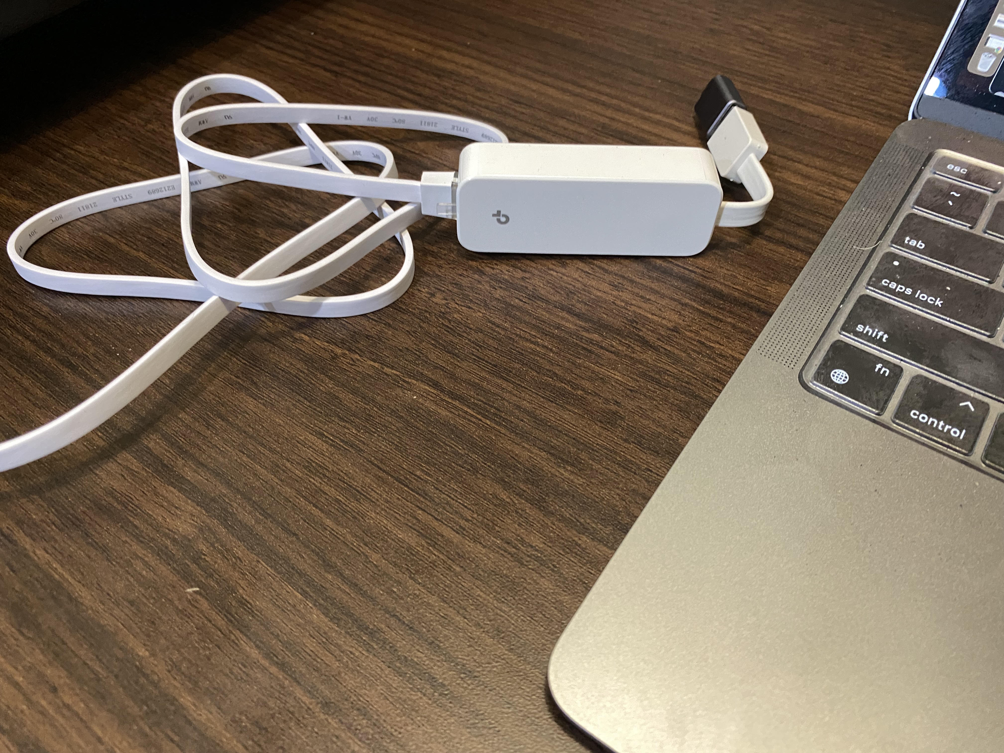 a laptop and charger on a table