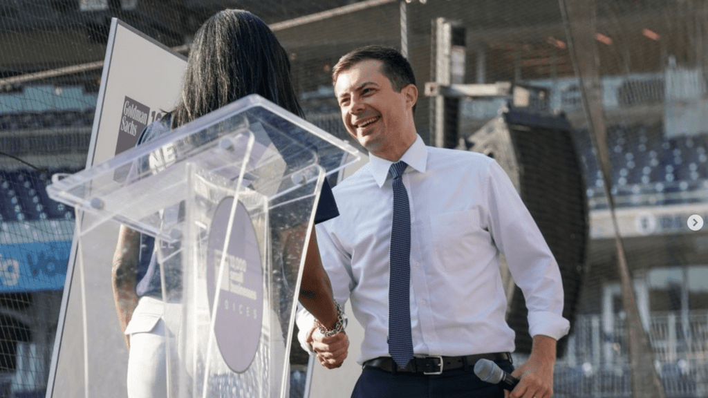 a man shaking hands with a woman