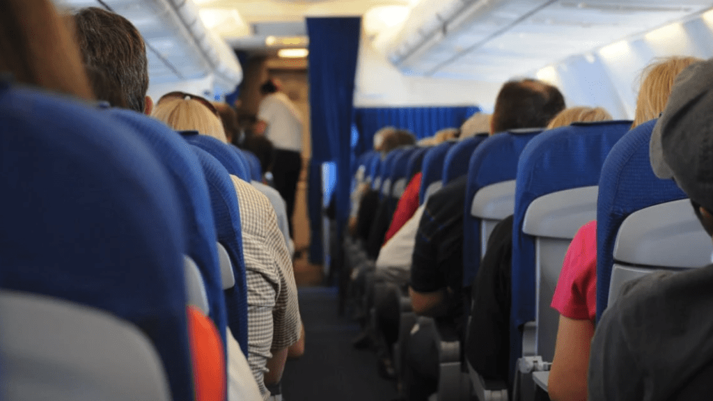 a group of people sitting in an airplane