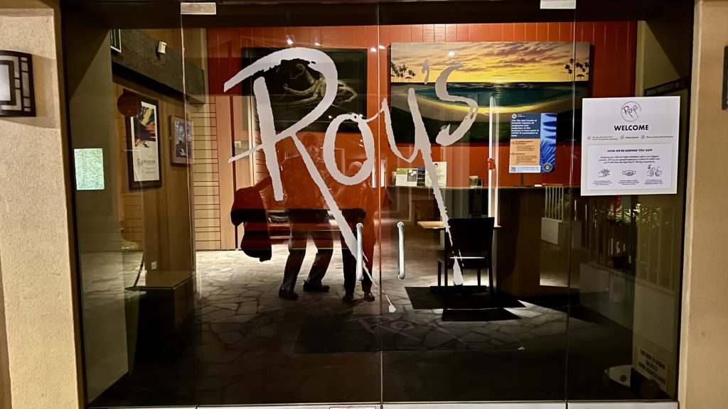 a glass door with a sign on it