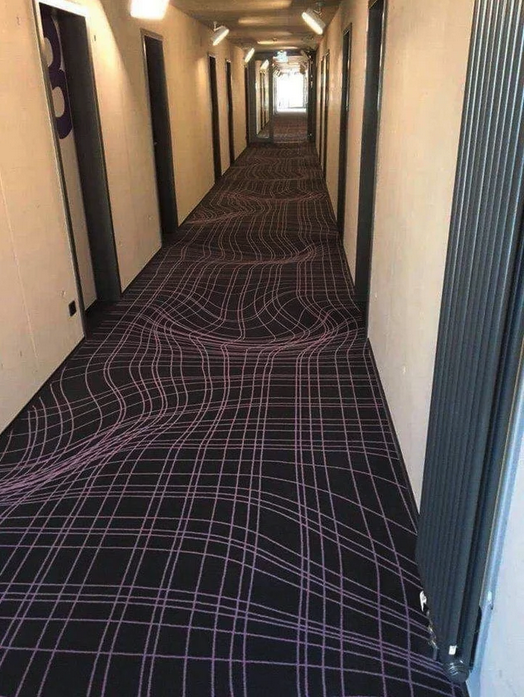 a hallway with a carpet