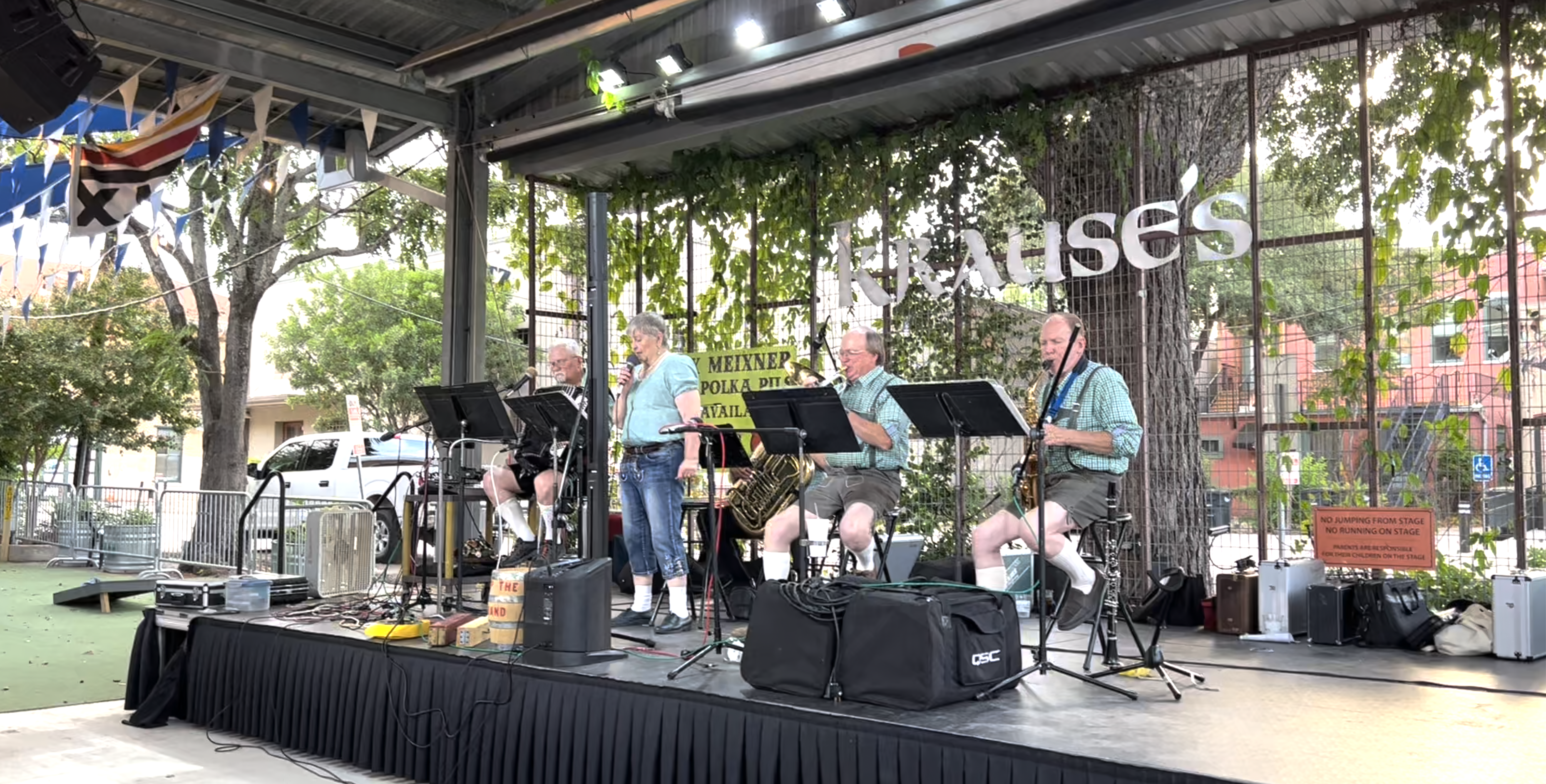 a group of people playing instruments on a stage