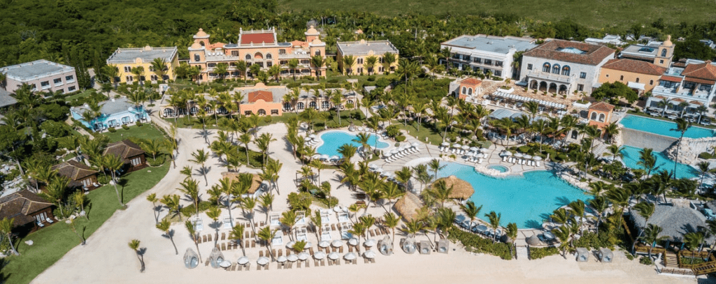 a resort with palm trees and a pool