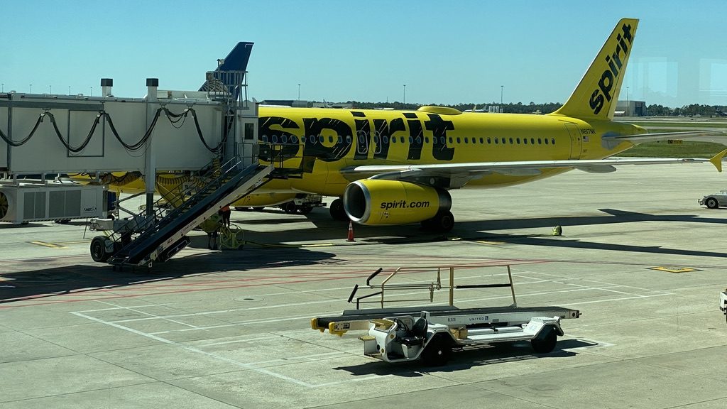 a yellow airplane with a staircase