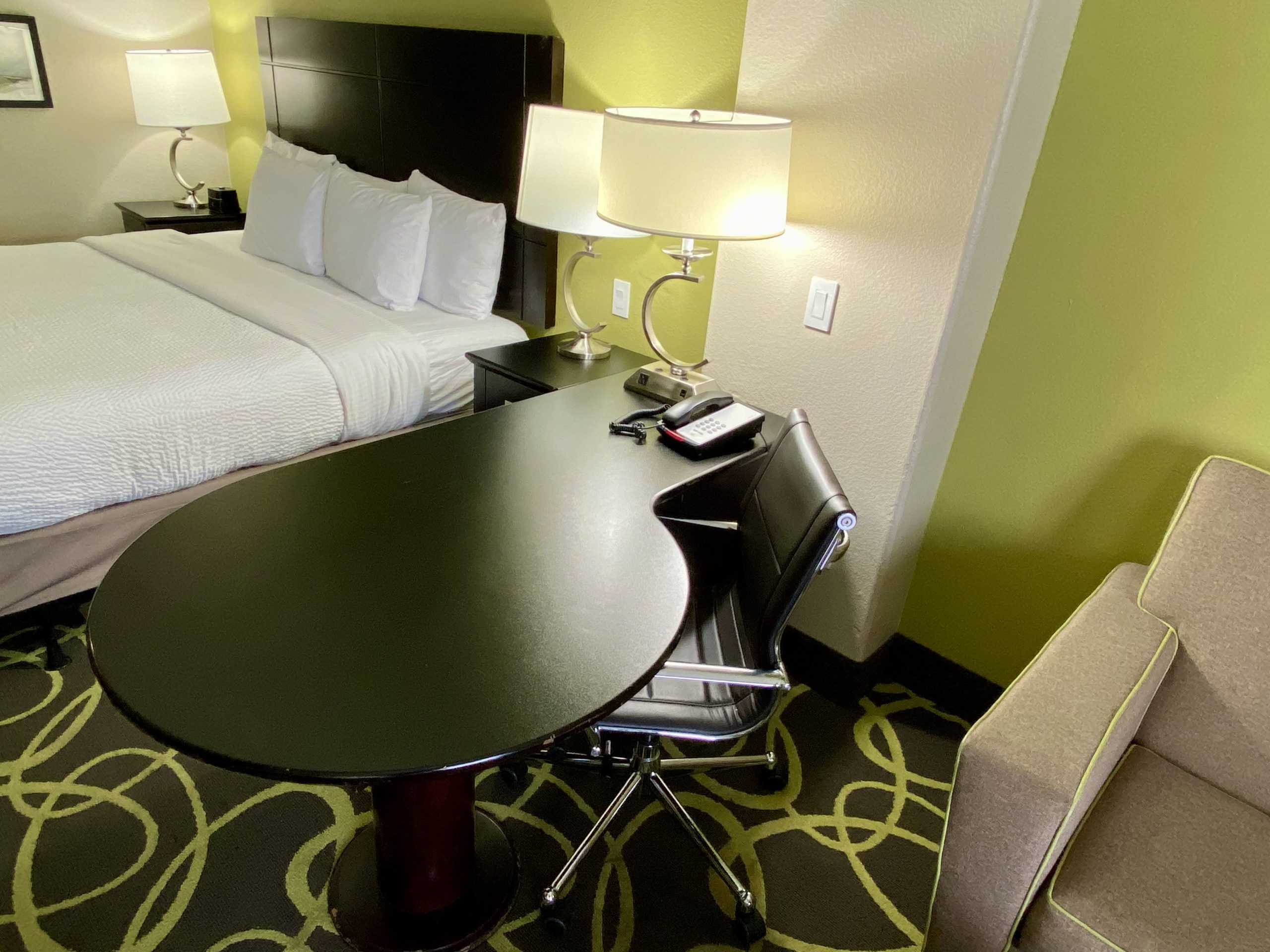 a desk and chair in a hotel room