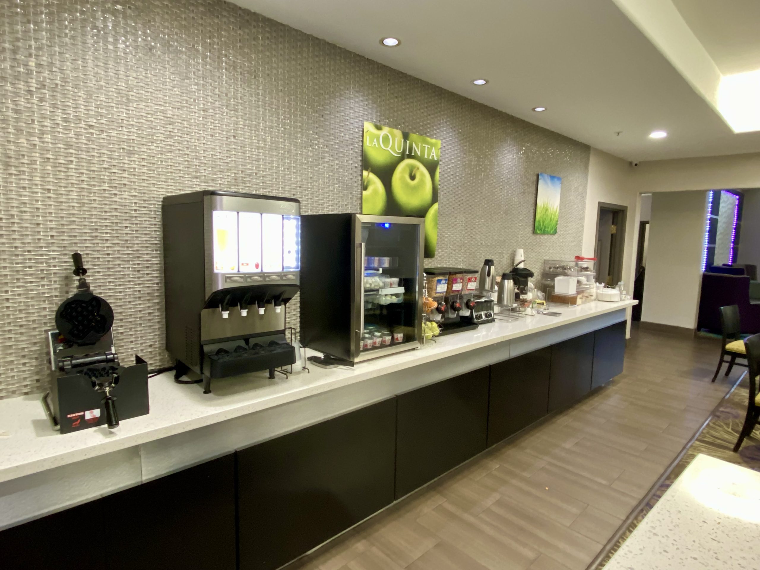 a coffee machine and coffee maker on a counter