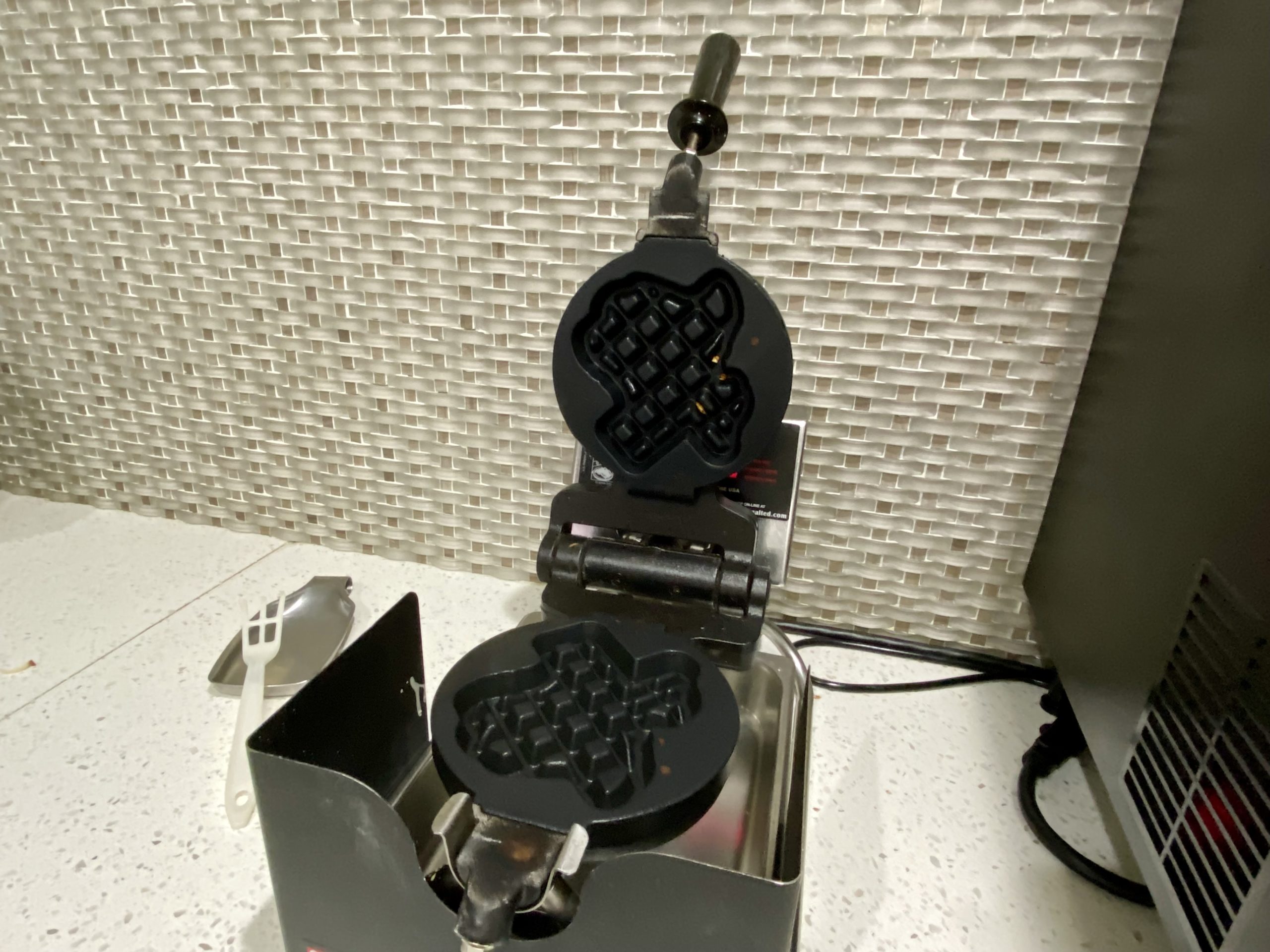 a waffle maker on a counter