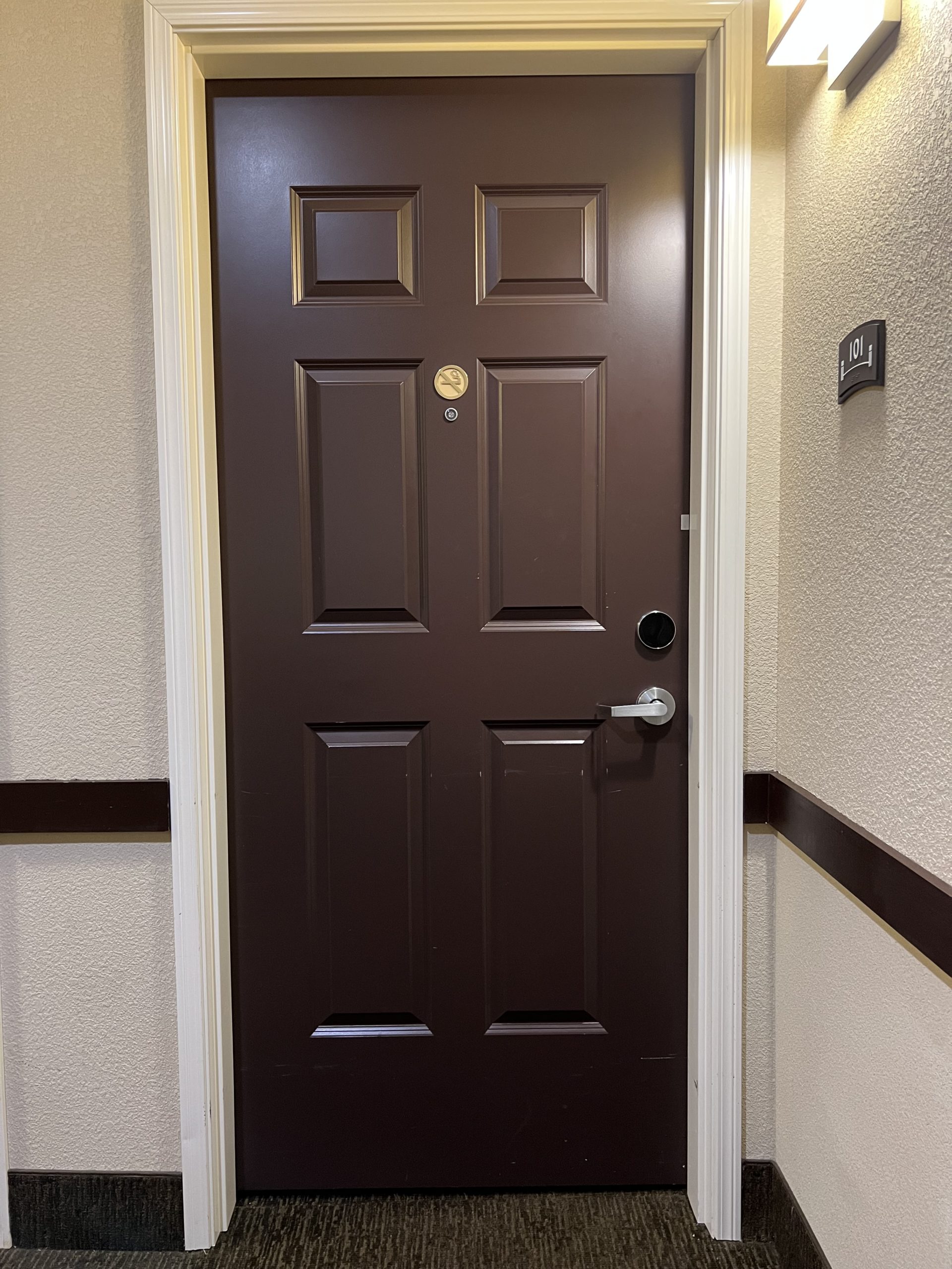 a brown door in a hallway