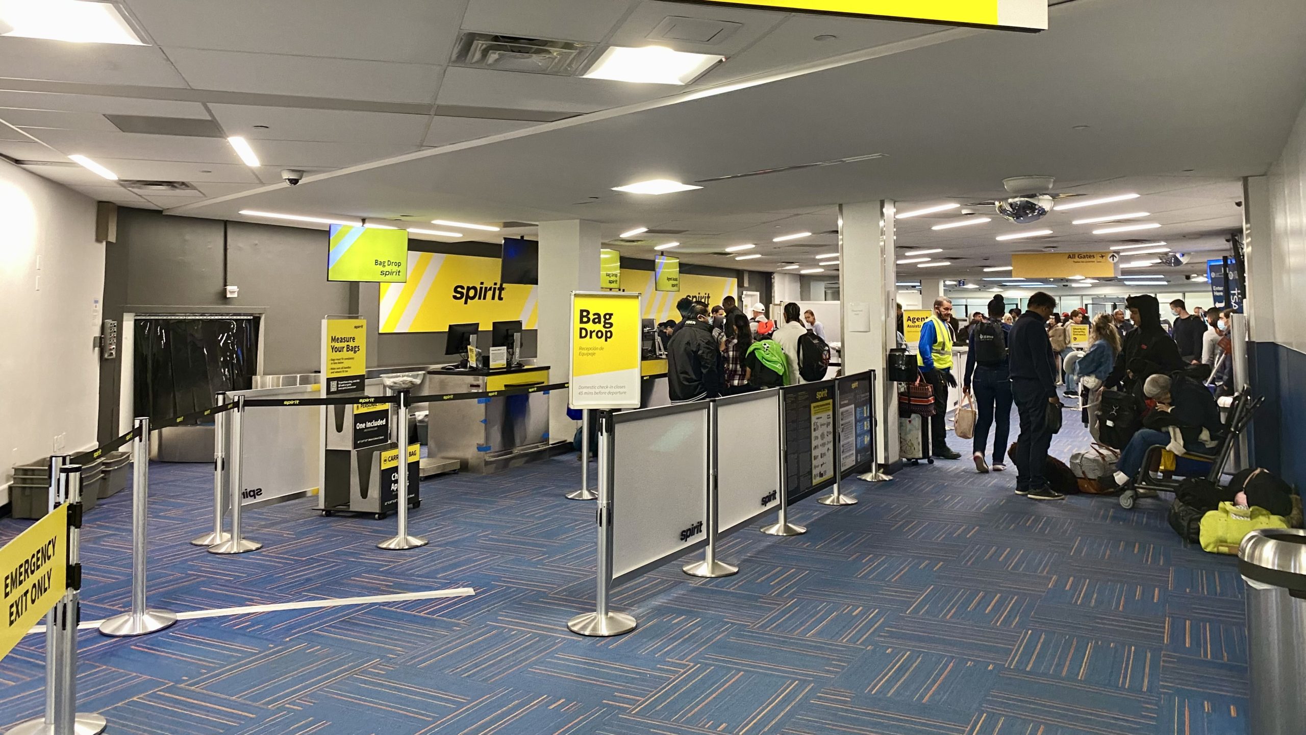 people standing in a line in a terminal