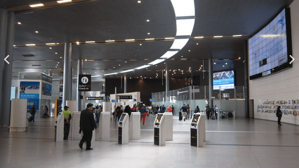 people in a large airport terminal