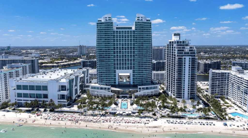 a large building next to a beach