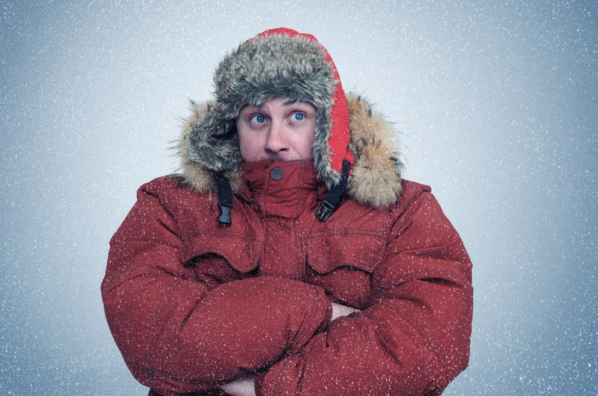 a man in a red coat with a fur hood