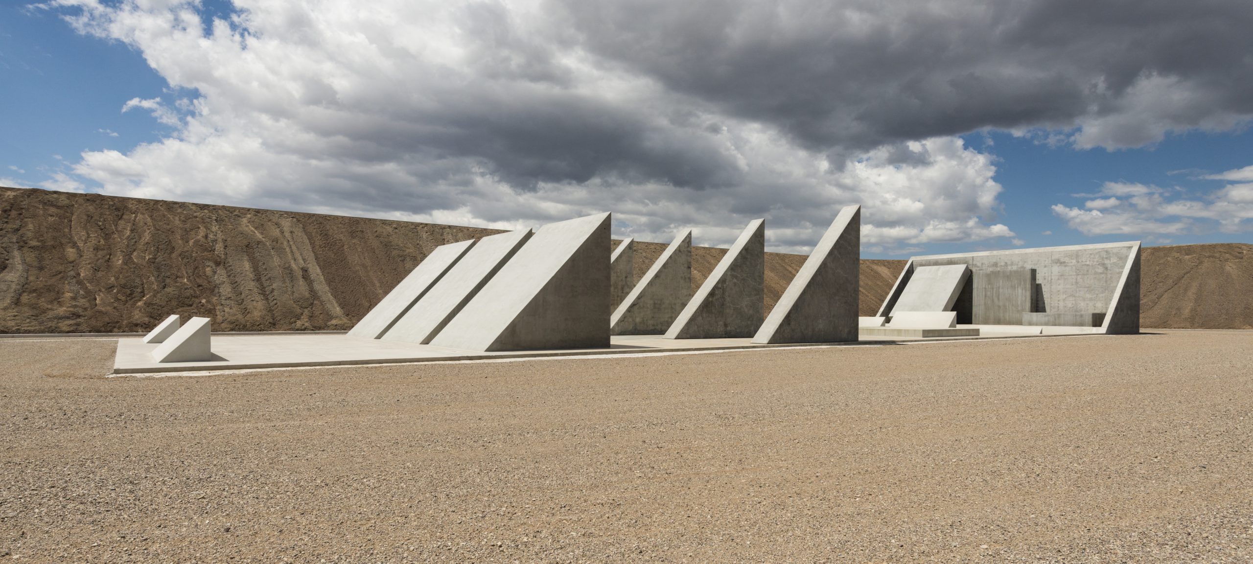a group of concrete structures in a desert