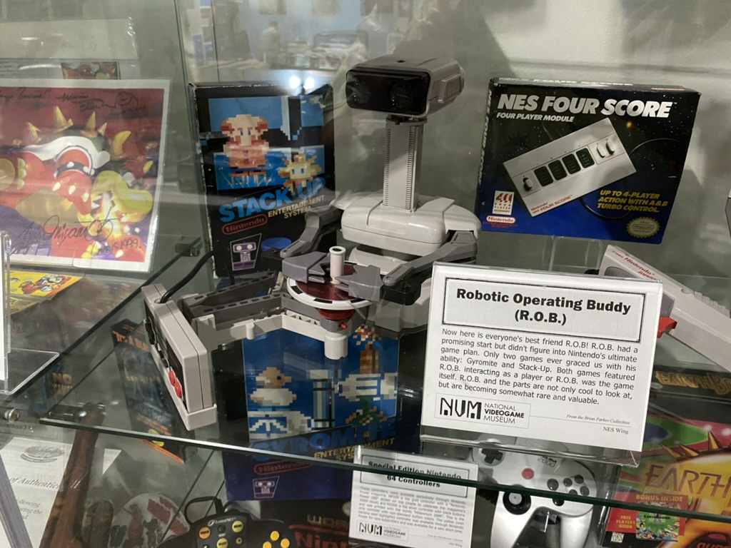 a video game system in a glass case