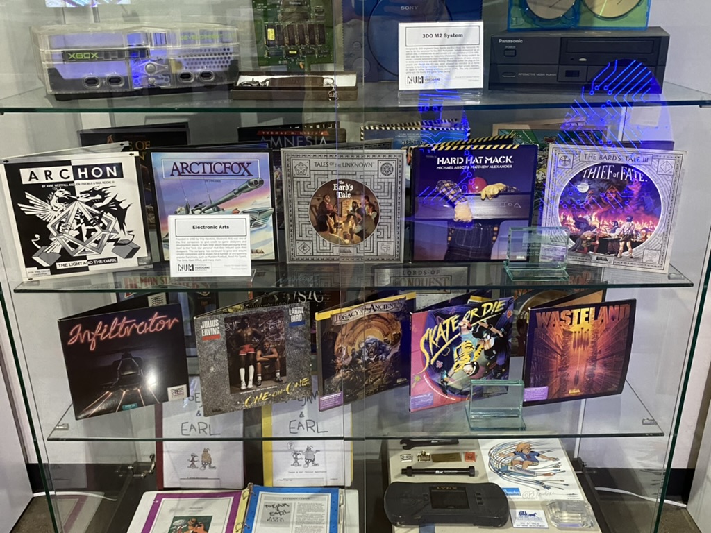 a glass case with a group of video game cases