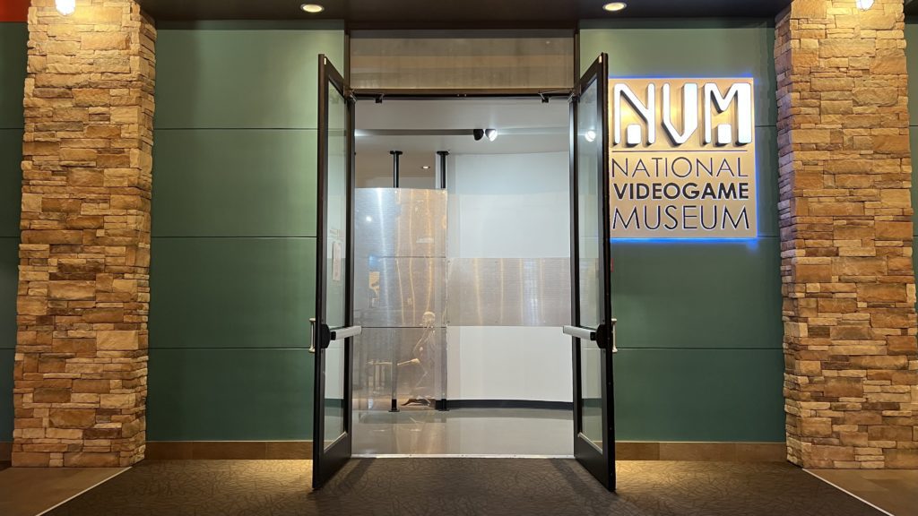 a glass doors leading to a museum