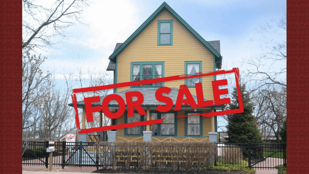 a house with a fence and a sign