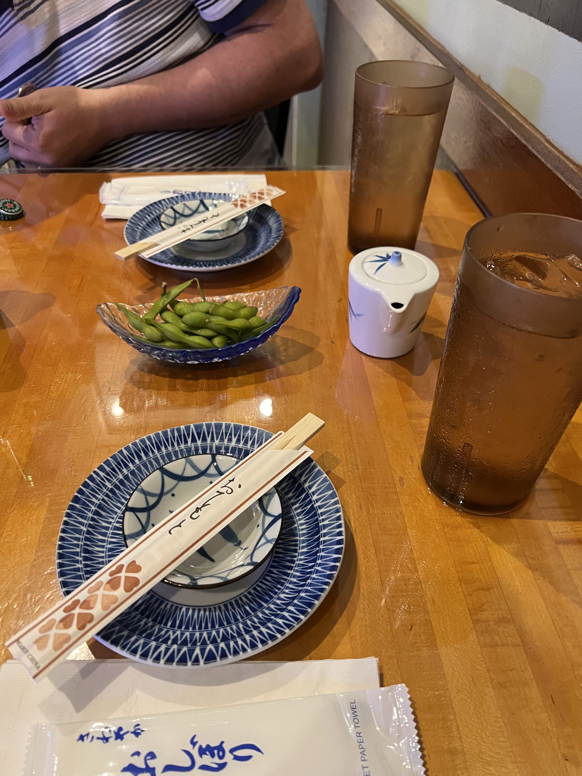 a table with plates and chopsticks on it