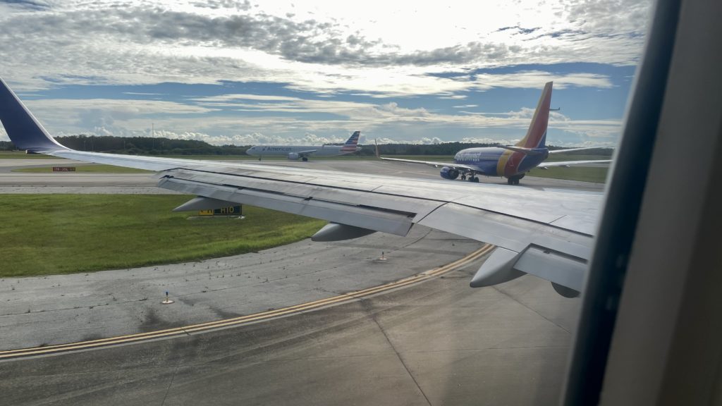 an airplane wing on a runway