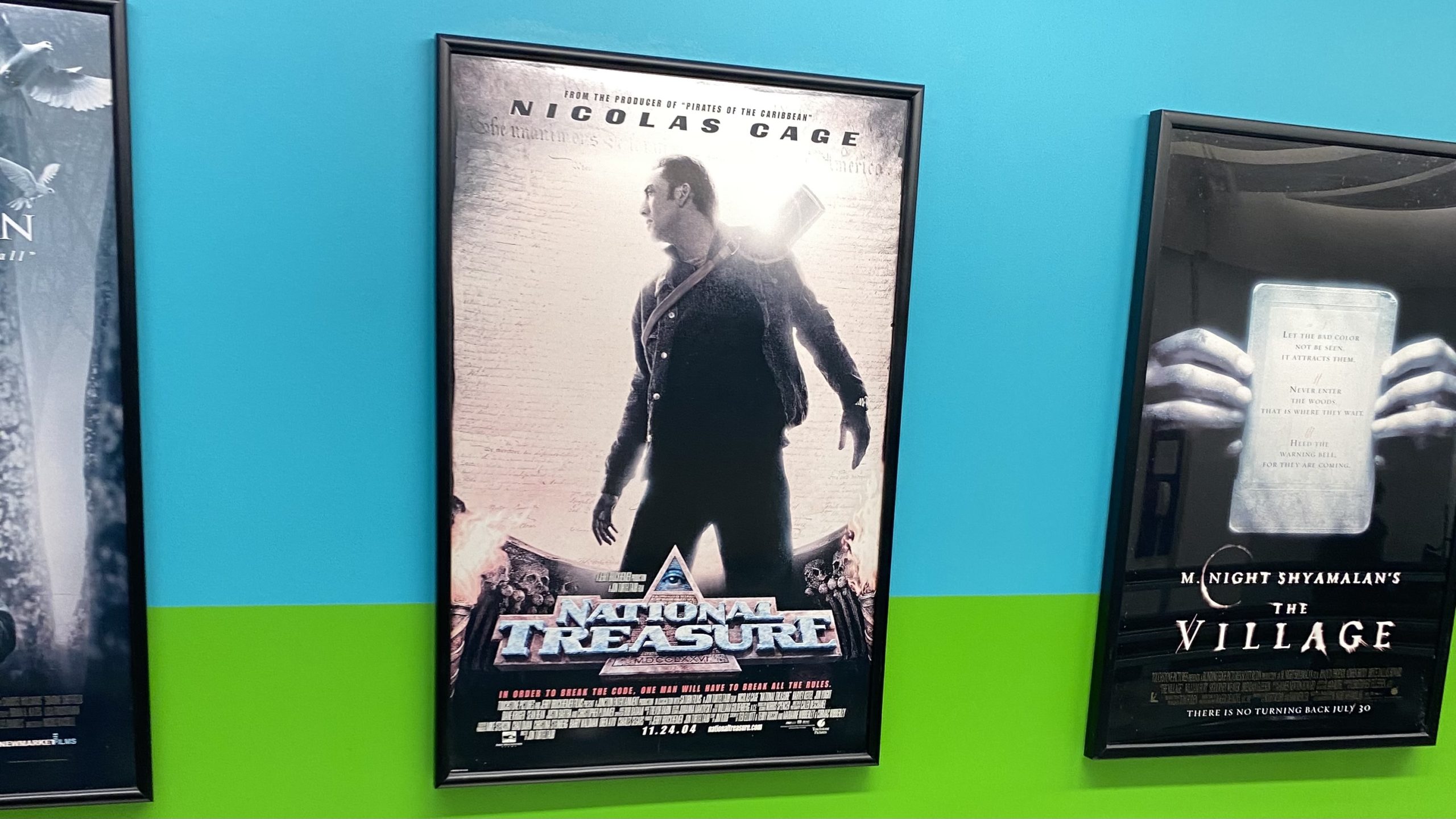 a movie poster on a wall