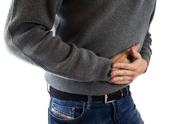 a person holding his stomach