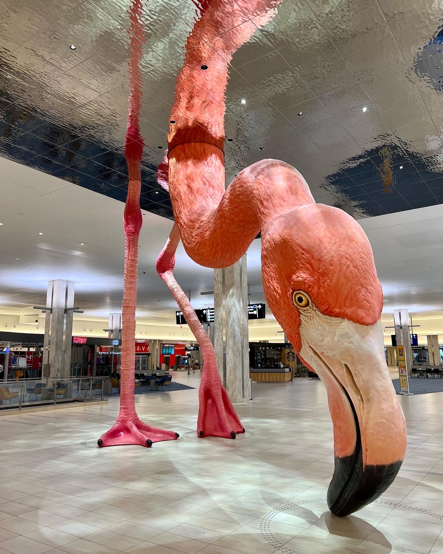 a flamingo statue in a building