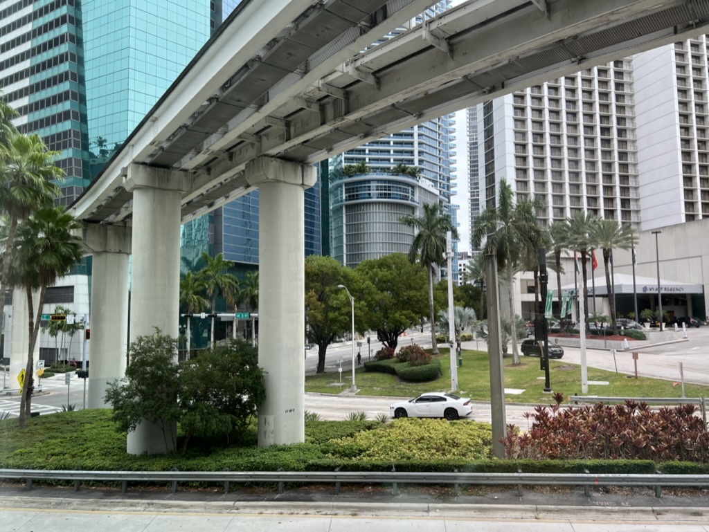 a city street with a train overpass