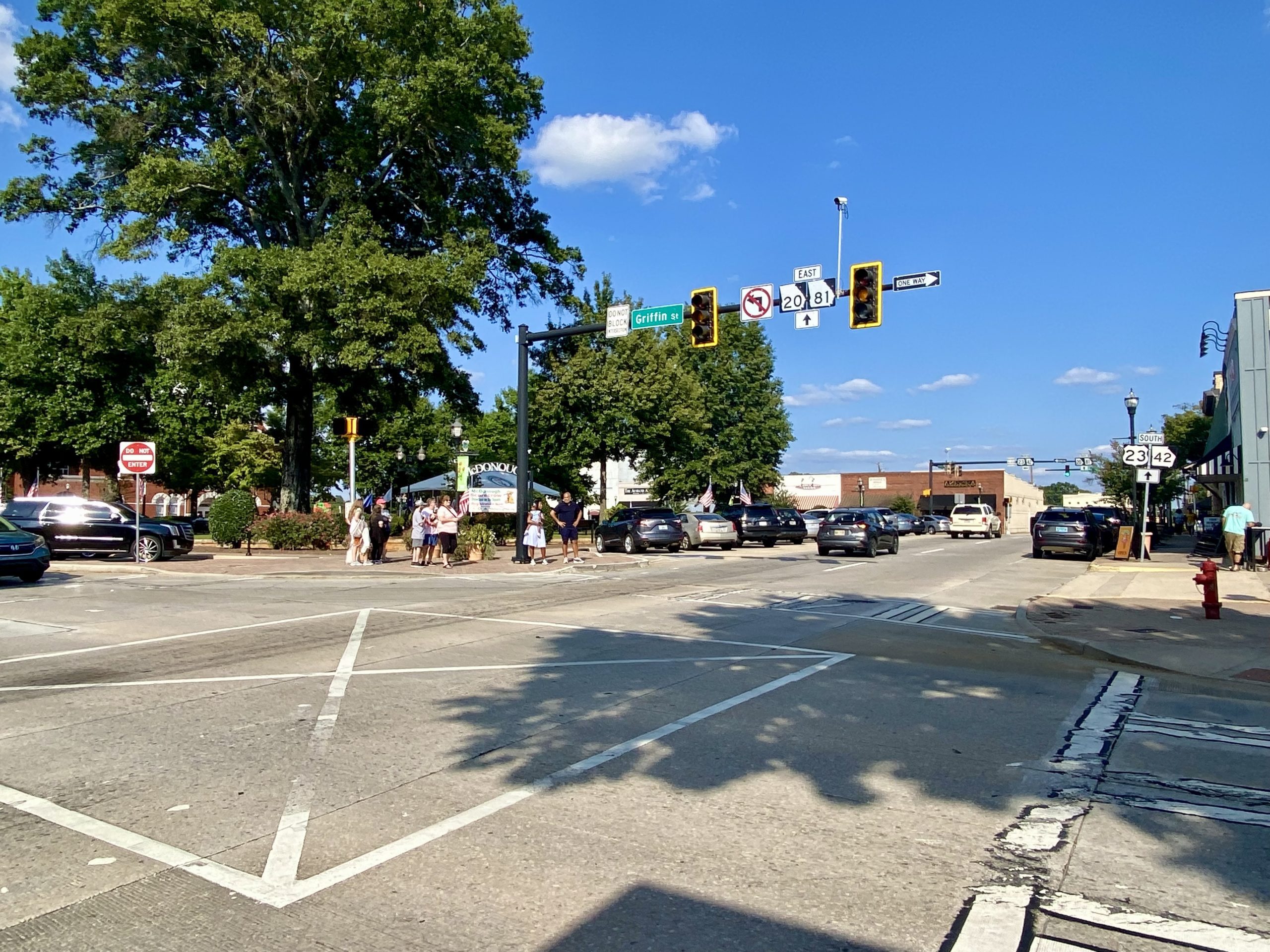 a street with traffic lights and cars on the street