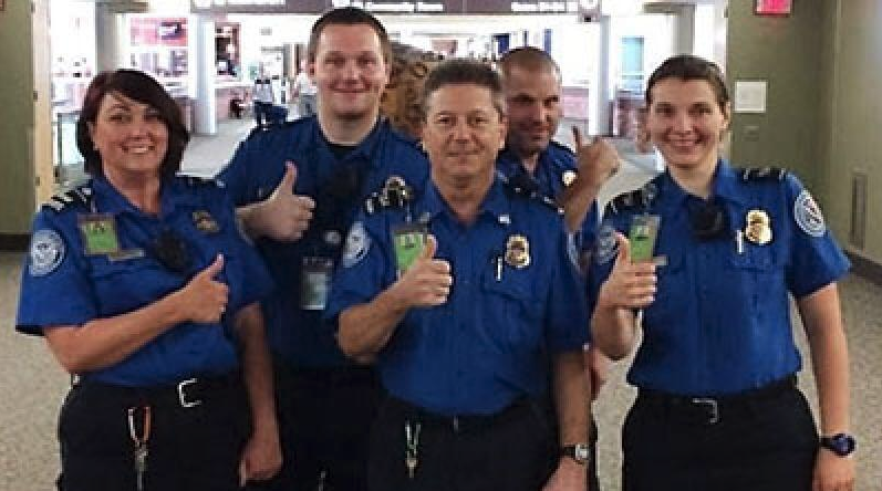 a group of police officers giving thumbs up