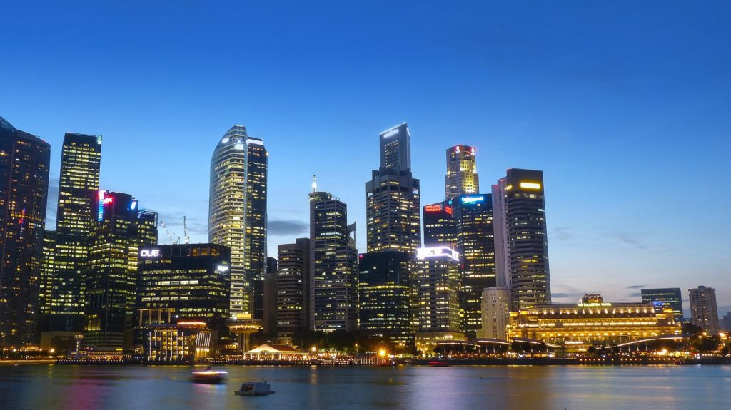 a city skyline with lights at night