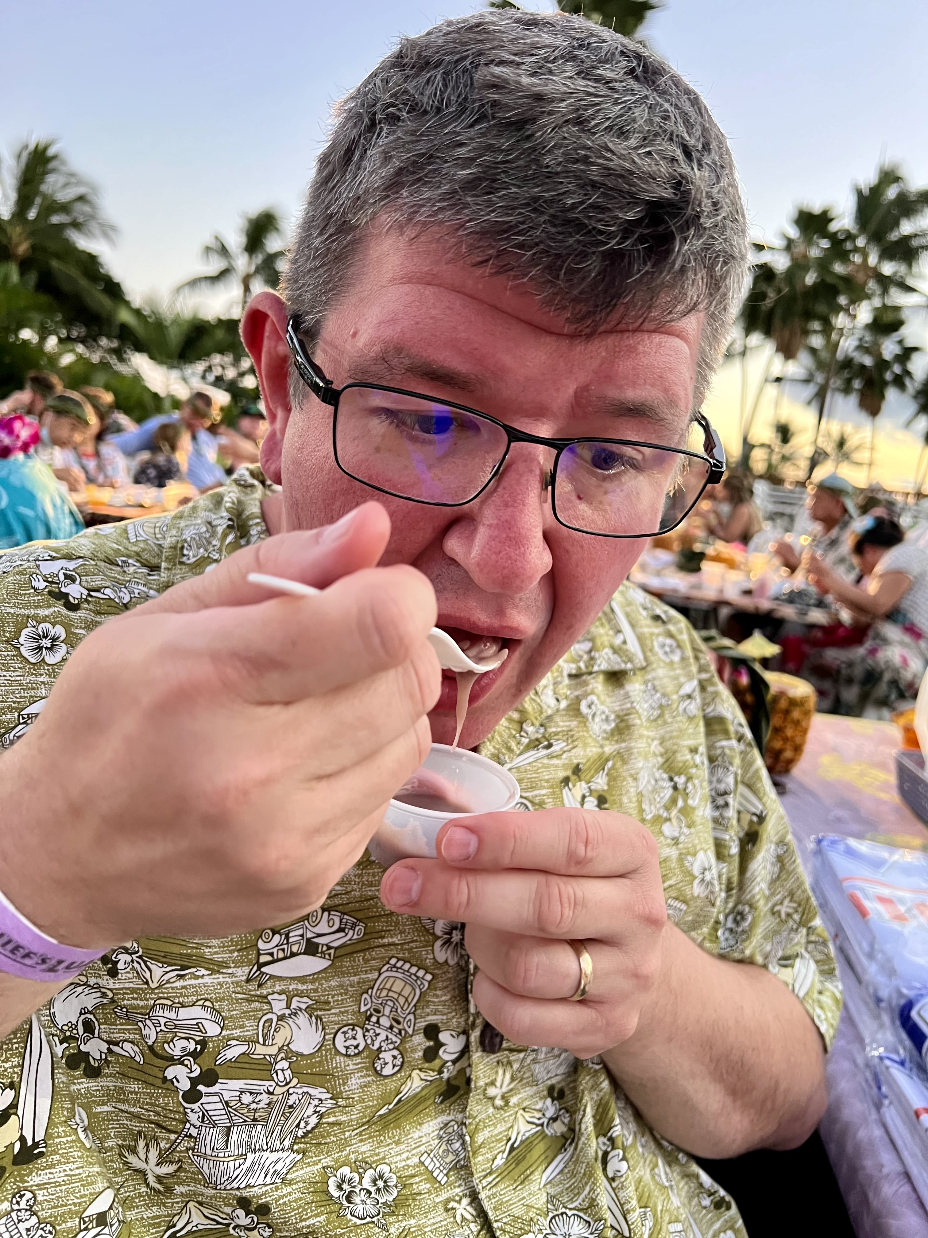 a man eating from a spoon